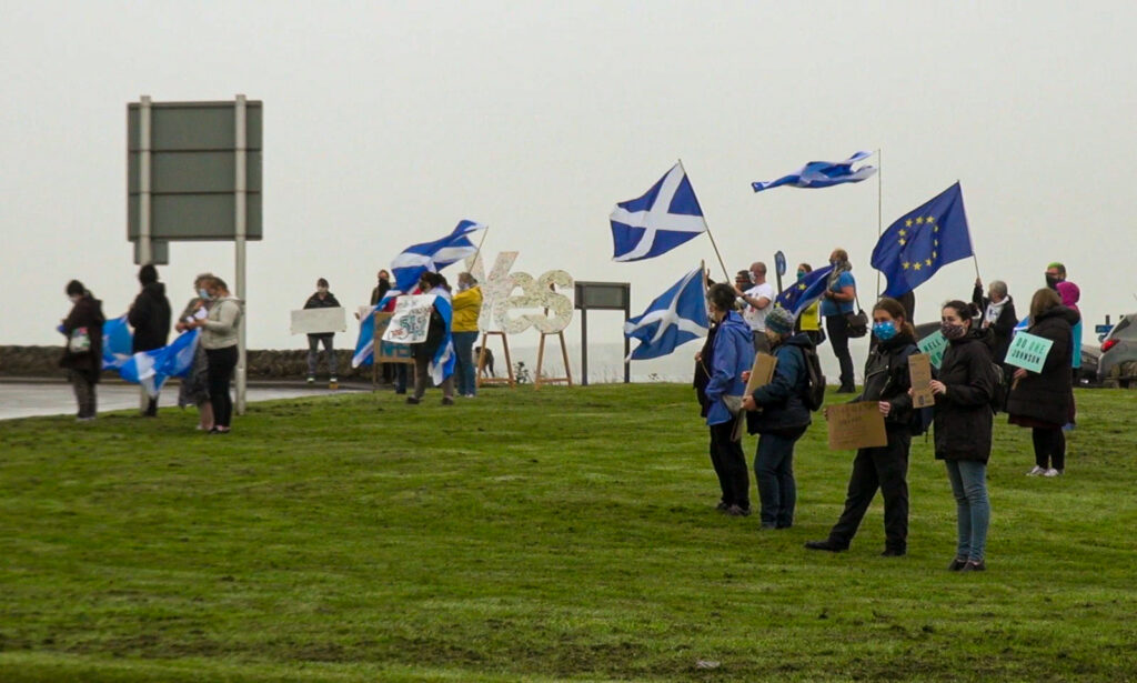 Flag waving protestors at Ayre Mills roundabout in Kirkwall